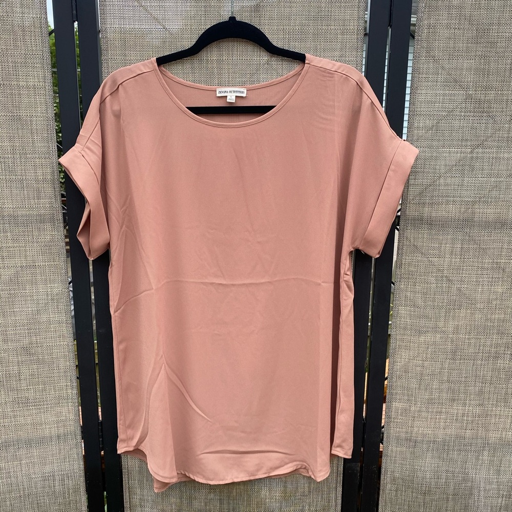 Short sleeve, round neck, tunic length blouse.